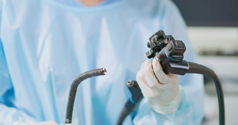 Physician checking colonoscopy device 