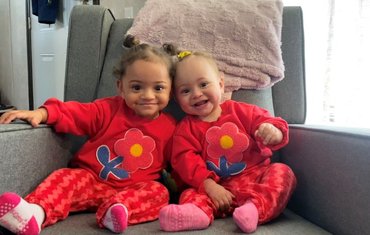 two babies smiling