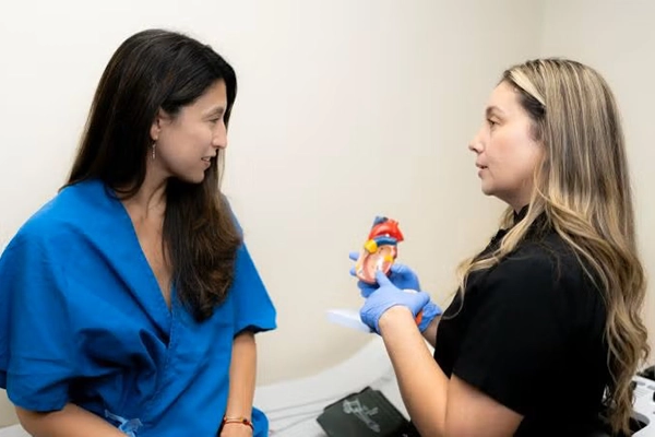 A provider explains CT Angiography to a patient